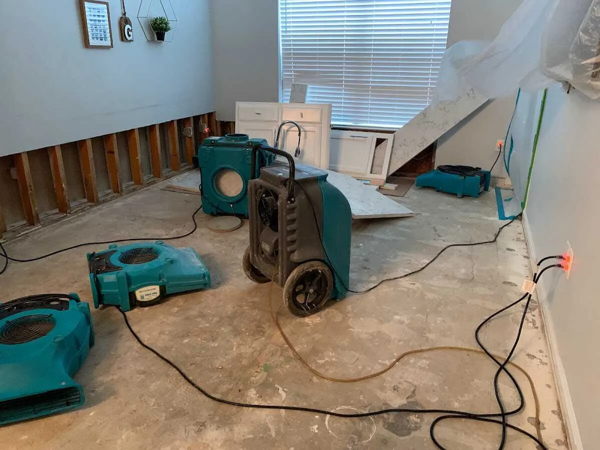 Dehumidifier in flood-cut room for Water Damage Restoration in Layton